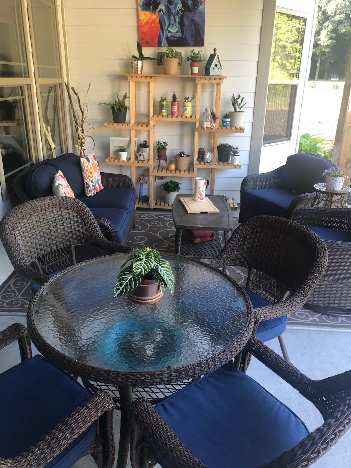 Covered back porch with clean wicker furniture and swept floor by Spotless Cleaning Services in Monroe, NC
