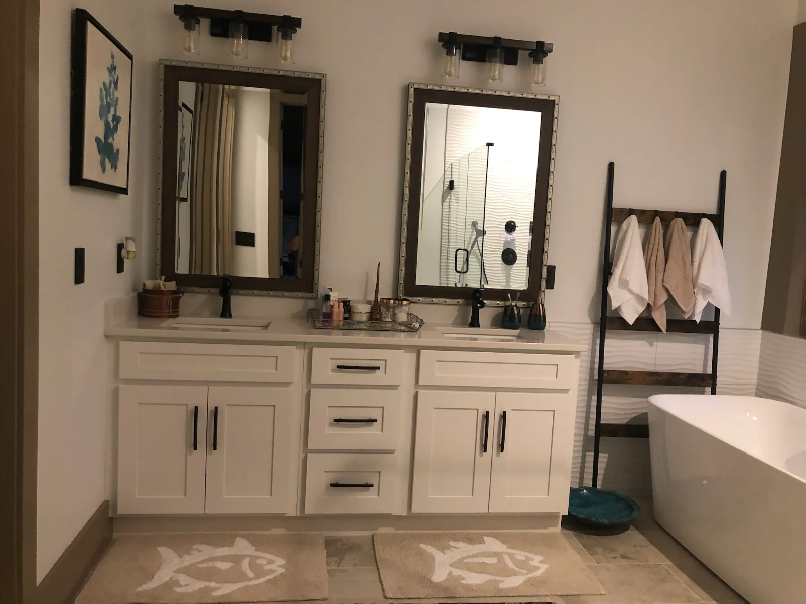 Double bathroom vanity with polished mirrors and wiped countertops by Spotless Cleaning Services in Monroe, NC