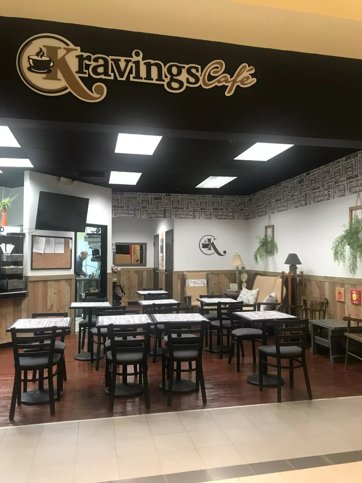 Clean café dining room with wiped tables and polished floors after commercial cleaning by Spotless Cleaning Services