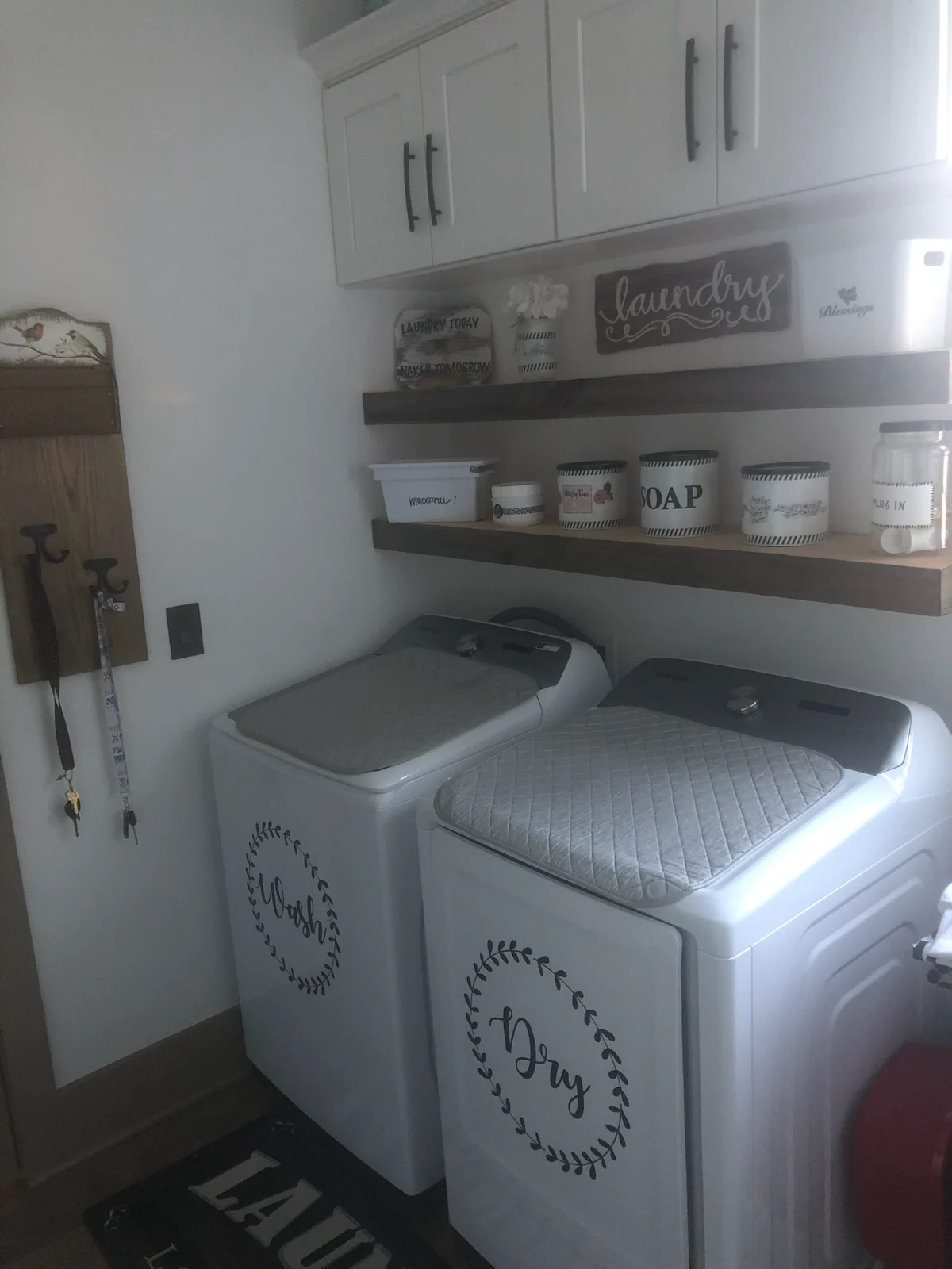 Tidy laundry room with clean washer, dryer and organized shelves by Spotless Cleaning Services in Monroe, NC