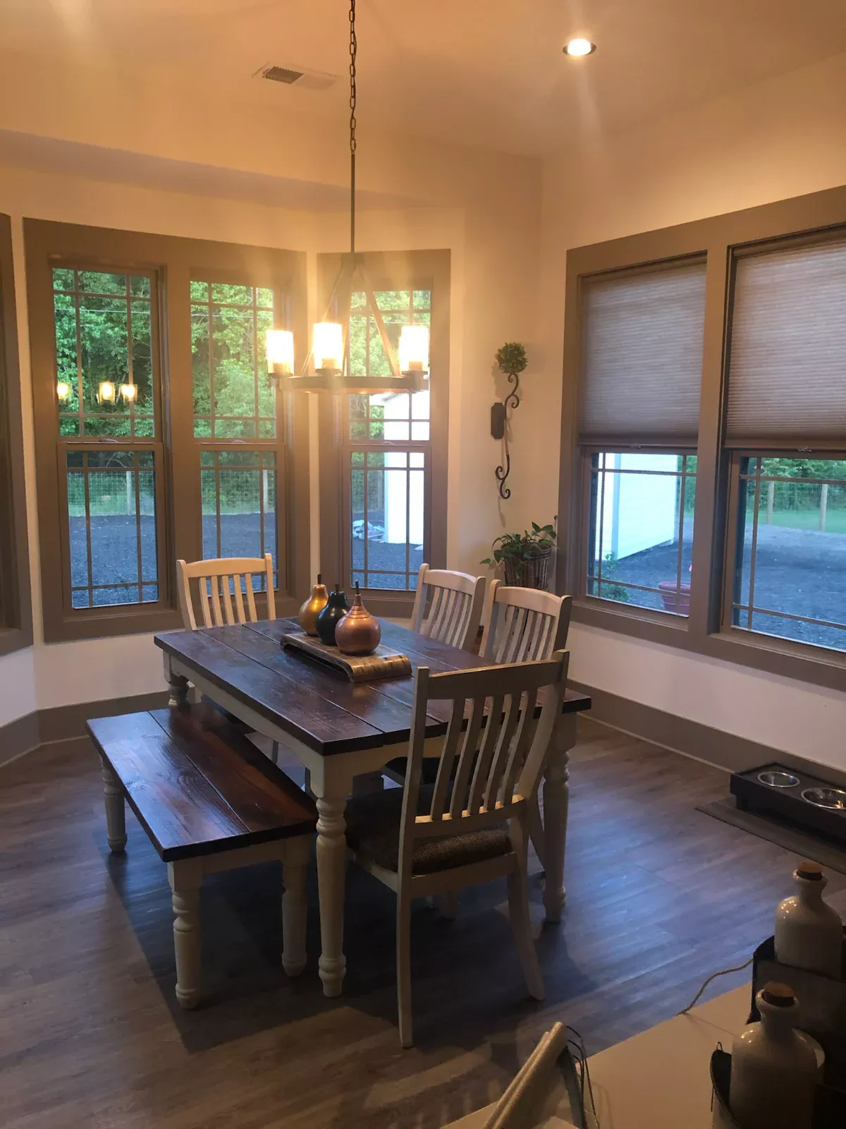 Clean farmhouse dining room with polished table and floors after a residential cleaning in Monroe, NC